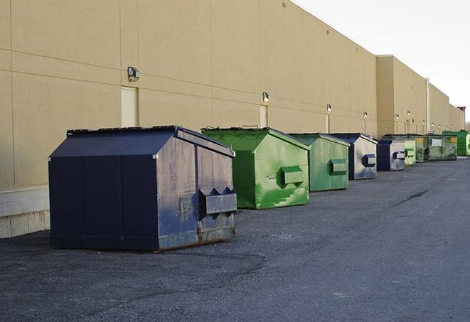 construction dumpsters stacked in a row on a job site in Deerfield